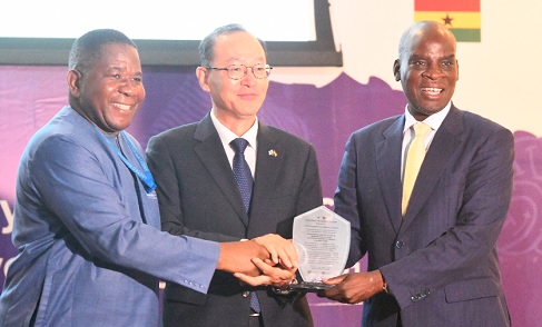 Haruna Iddrisu (right), Minister of Education, presenting a plaque to Kyongsig Park (middle), Ambassador of the Republic of Korea to Ghana, at the ceremony in Accra. With them is Edmond Moukala (left), Head of Office and Representative of UNESCO to Ghana. Picture: SAMUEL TEI ADANO
