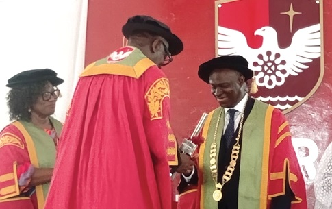 Pastor Mensa Otabil (middle), Chancellor of Central University, swearing in Prof. Samuel Kwasi Dartey-Baah as the new Vice-Chancellor of the University