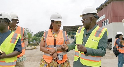 Kwaku Ennin (right), Board Chairman and President of Zeal Environmental Technologies Limited Ghana, taking Emeafa Hardcastle, CEO of Petroleum Commission, through some aspects of their operations