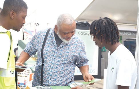 Exhibitors of the Daily Graphic-GREDA Home Fair interacting with prospective house buyers and customers at their booths