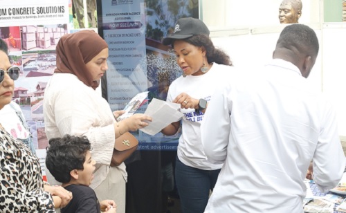 Exhibitors of the Daily Graphic-GREDA Home Fair interacting with prospective house buyers and customers at their booths