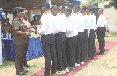 DPP Augustina Mensah-Fiadzo (left), Officer in Charge of James Camp Prison, presenting certificate to the graduates. Picture: ESTHER ADJORKOR ADJEI DPP Augustina Mensah-Fiadzo (left), Officer in Charge of James Camp Prison, presenting certificate to the graduates. Picture: ESTHER ADJORKOR ADJEI