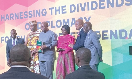 President John Mahama (3rd from left) with the documents on the key performance indicators. Those with him are Vice-President Prof. Naana Jane Opoku-Agyemang (3rd from  right); Samuel Okudzeto Ablakwa (2nd from right), Minister of Foreign Affairs; Nii Tackie Teiko Tsuru II (2nd from left), Ga Mantse, and Dr Evans Aggrey-Darkoh (left), Head of the Civil Service