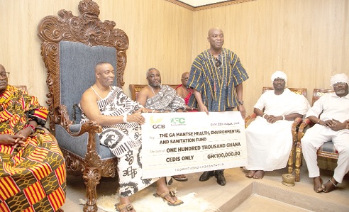 Dr Hugh A. Brown, Chief Executive of the Forestry Commission, presenting a dummy cheque for GH100,000 to the Ga Mantse, King Nii Tackie Teiko Tsru II