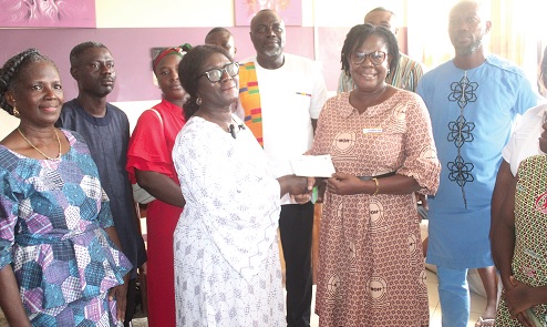 Claris Quartey-Papafio (2nd from left), CEO of A’vitaGhana, presenting a cheque to Elizabeth Kyei (2nd  from right), Deputy Chief Midwifery Officer of Korle Bu Teaching Hospital.  Picture: ESTHER ADJORKOR ADJEI 