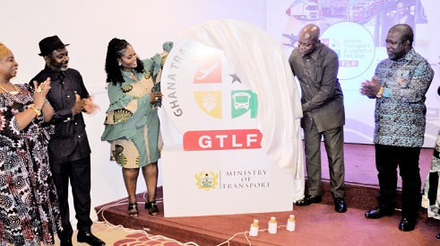 Joseph Bukari Nikpe (2nd from right), Minister of Transport, unveiling the logo of the fair while other dignitaries look on