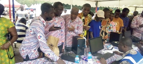 Some of the members going through the voting process at the AGM Some of the members going through the voting process at the AGM