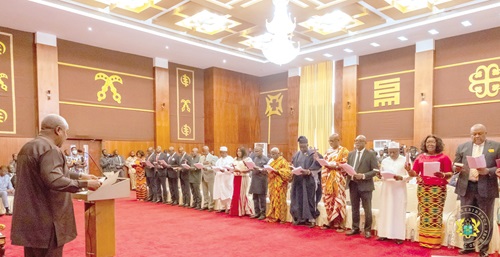 President Mahama (left) administering the oath of office to the new envoys President Mahama (left) administering the oath of office to the new envoys