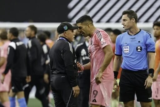Luis Suarez banned for 6 matches for spitting at opposing coach