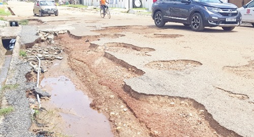 A pothA pothole-ridden roadole-ridden road