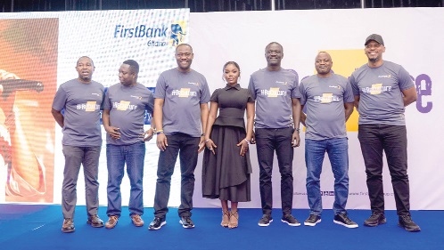 A cross-section of the FirstBank Ghana Management Committee with singer Gyakie who performed at the event A cross-section of the FirstBank Ghana Management Committee with singer Gyakie who performed at the event