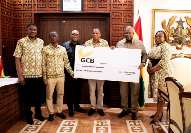 President John Dramani Mahama (2nd from right) receiving the dummy cheque from Farihan Alhassan (4th from right), MD, GCB Bank PLC, while other management staff look on President John Dramani Mahama (2nd from right) receiving the dummy cheque from Farihan Alhassan (4th from right), MD, GCB Bank PLC, while other management staff look on