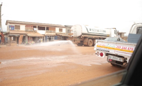 A water tanker spraying water to reduce dust  at Ashiyie on the Adentan-Dodowa road