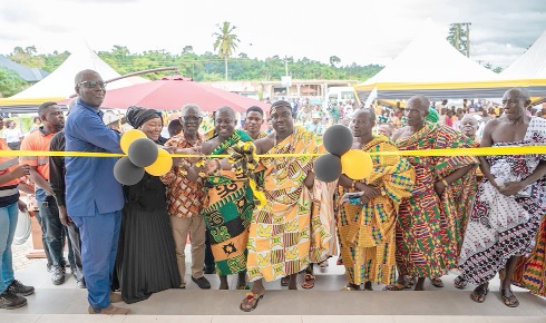Kwabena Brempong Marfo (middle), , Board Chairman of the trust fund joined by officials to cut the tape to officially inaugurate the project Kwabena Brempong Marfo (middle), , Board Chairman of the trust fund joined by officials to cut the tape to officially inaugurate the project