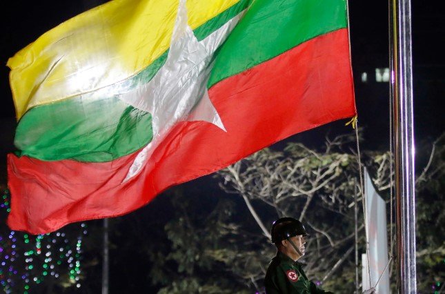 A Myanmar military soldier hoists a national flag during a ceremony to mark the 69th anniversary of Independence Day in Yangon, Myanmar, on Jan. 4, 2017. (AP Photo) A Myanmar military soldier hoists a national flag during a ceremony to mark the 69th anniversary of Independence Day in Yangon, Myanmar, on Jan. 4, 2017. (AP Photo)