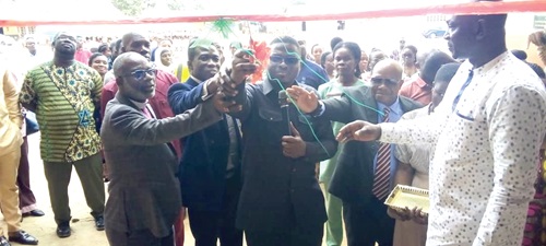 Emmanuel Adotey Allotey (middle), the Ga Central Municipal Chief Executive, cutting the tape to inaugurate the facility. INSET: The 18-unit classroom block Emmanuel Adotey Allotey (middle), the Ga Central Municipal Chief Executive, cutting the tape to inaugurate the facility. INSET: The 18-unit classroom block