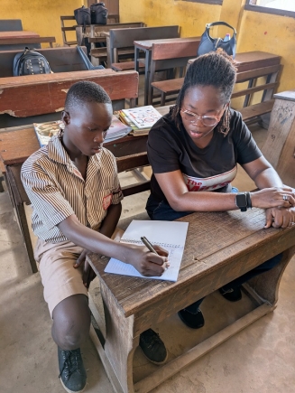 Our reporter, Efia Akese interacting with Kennedy Mensah Dogbe, a beneficiary of the ‘Camp Dream.Speak.Live’