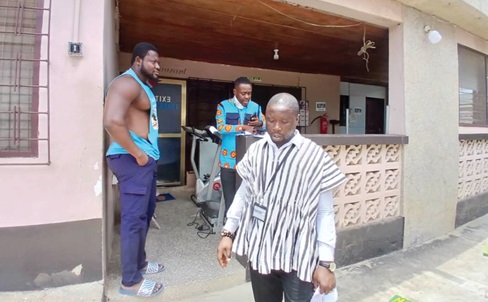 GTA officials interacting with the facility manager at Samaki Guest House in Koforidua