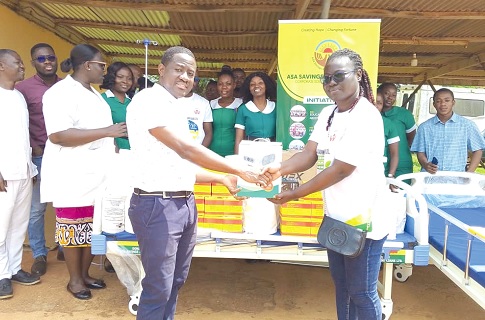 Lily Opoku Mensah (right), Corporate Social Responsibility, Sustainability Officer, ASA, presenting the medical items to Dr Prince Kofi Dwomoh-Kesse, Clinical Coordinator at the hospital. INSET: Some of the medical items