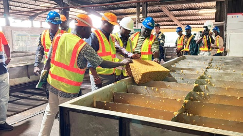 Joseph Nelson (2nd from left), Western Regional Minister, examining some of the semi-processed rubber products ready for export