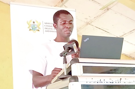 Austin Hesse (left), Director of Policy Planning, Budget, Monitoring, and Evaluation of the Ministry of Communication, Digital Technology and Innovations, speaking at the event