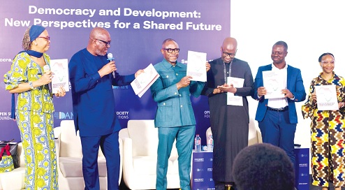 Professor Henry Kwesi Prempeh (2nd from left), Executive Director, CDD-Ghana, and dignitaries displaying copies of the research report