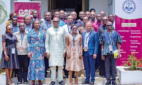 Prosper Bani (middle), National Security Advisor to President, and participants after the launch Prosper Bani (middle), National Security Advisor to President, and participants after the launch