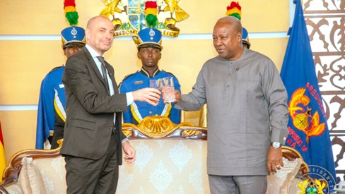 President Mahama proposing a toast with Jakob Linulf, Ambassador of Denmark President Mahama proposing a toast with Jakob Linulf, Ambassador of Denmark