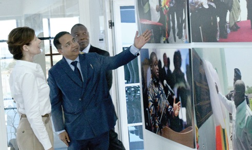 Dhananjat Tripathi (2nd from left), Chief Executive Officer, Atlantic Lifesciences Limited, showing some photographs of the company to Baroness Chapman (left), UK Minister of State, International Development Dhananjat Tripathi (2nd from left), Chief Executive Officer, Atlantic Lifesciences Limited, showing some photographs of the company to Baroness Chapman (left), UK Minister of State, International Development