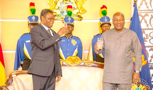 President Mahama proposing a toast with Colonel (rtd) Shem Ishahilidza Amadi, Kenyan High Commissioner to Ghana 