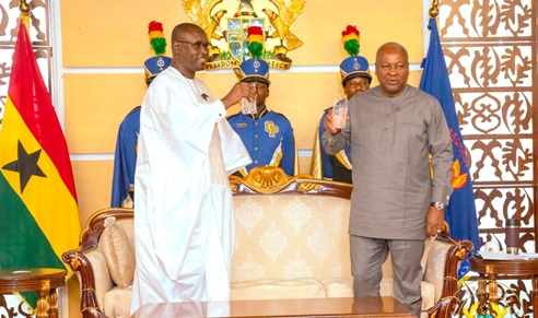 President Mahama proposing a toast with Amadou Ndene Ndoye, Ambassador of Senegal