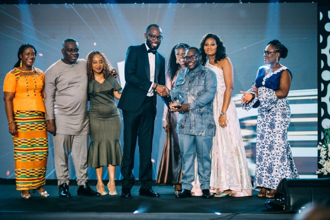 Head of Claims at Serene Insurance, Mr. Daniel Otoo supported by the CEO and colleagues receiving the award at the 5th CIIG Insurance Excellence Awards at the Kempinski Hotel in Accra.