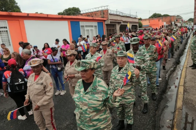 Members of the National Bolivarian Militia, a reserve force made up of civilian volunteers, responded to Venezuelan President Nicolas Maduro's call to defend national sovereignty this month, amid escalating tensions with the US [File: Juan Carlos Hernandez/Reuters]