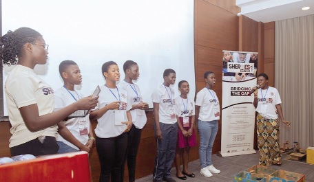 Participants from the smart house team demonstrating how their prototype uses sensors to control lighting and appliances Participants from the smart house team demonstrating how their prototype uses sensors to control lighting and appliances