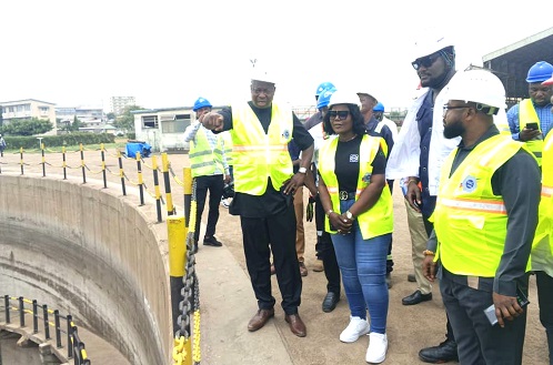 Alhaji Osman Sulemana (left), acting Chief Executive Officer, PSC Tema Shipyard Limited, briefing Dorcas Affo-Toffey, Deputy Minister of Transport, on the operations of the facility during the visit