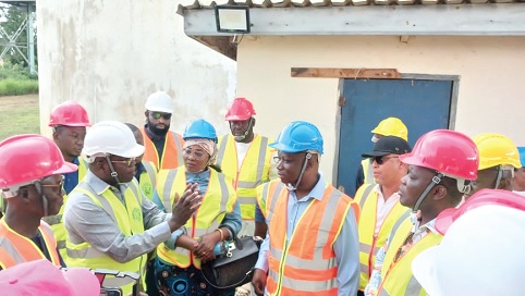 Stephen Amihere-Mensah (left), Northern Regional Manager of GWL briefing members of the committee during the visit