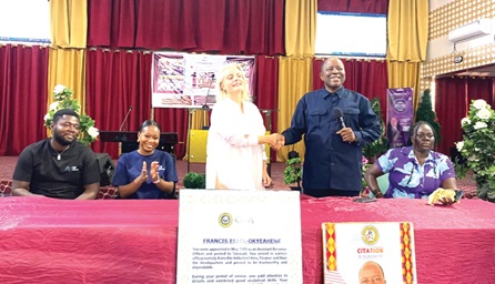Simone Giger (left),  Swiss Ambassador to Ghana, in a handshake with Rev. Nana Francis Essel-Okyeahene I, Founder of Young Executive School