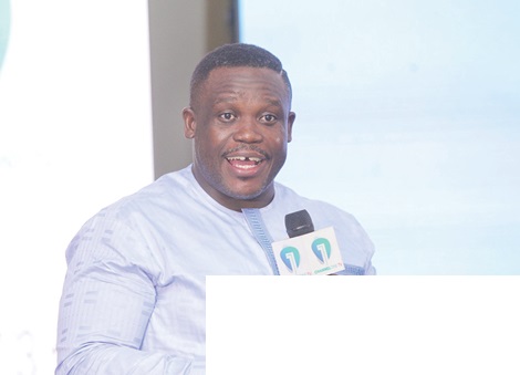 Sam Nartey George (inset), Minister of Communication, Digital Technology and Innovations, addressing the audience during the event. Picture: CALEB VANDERPUYE