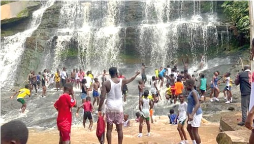 Some tourists at the Kintampo Waterfalls having fun