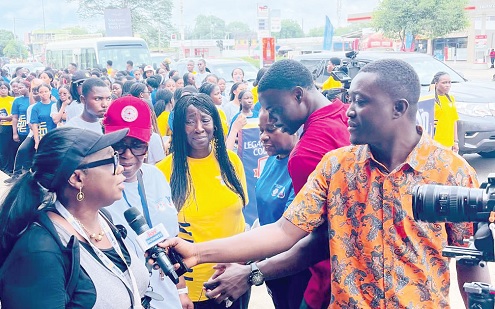 Dr Ellen Hagan, co-founder of Legacy Girls’ College, speaking to the media during the walk
