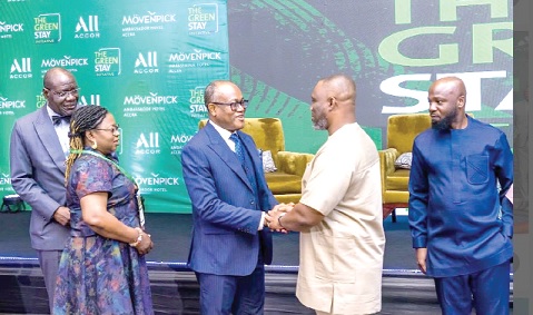 Kenneth Gilbert Adjei (2nd from right), the Minister of Works, Housing and Water Resources, in an interaction with  Isaac Okpoti Adjei, the General Manager of Movenpick Ambassador Hotel