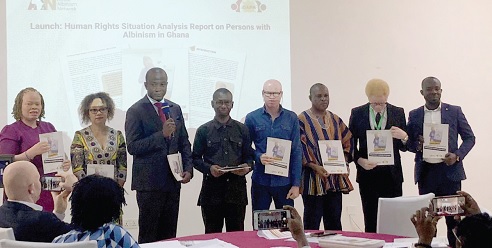 Michael Sumaila (3rd from left), Deputy Technical Aide in charge of Finance and Administration at the Office of the President, launching the report with other stakeholders