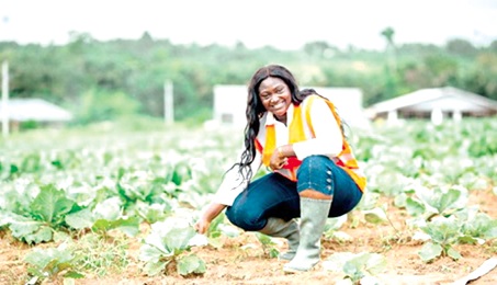Esther Kyerewaa Twumasi, founder of Miss Agriculture, on one of her farms