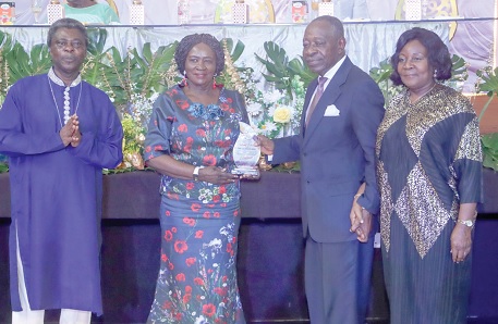 Prof. Naana Jane Opoku-Agyemang (2nd from left), the Vice-President, presenting the Special Centenary Award to Kingsford Amoah, Chairman of the Anniversary Planning Committee. With them is Very Rev Joseph Maxwell Osei (left), Superintendent Mininster of Accra North Circuit, Methodist Church