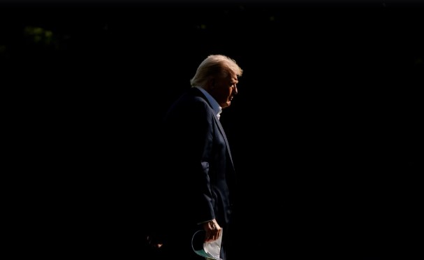 President Donald Trump walks across the South Lawn of the White House on September 26. Julia Demaree Nikhinson/AP
