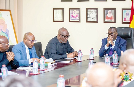 Prof. H. Kwasi Prempeh (3rd from left), Chairman of CRC, speaking during the meeting with Justice Paul Baffoe-Bonnie, Chief Justice (head of the table)