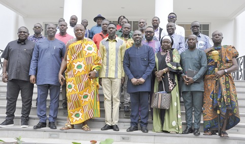 Togbe Afede XIV (in kente), Agbogbomefia of Asogli; Courage Nunekpeku (2nd from left), Managing Director of Tema Development Corporation, and some members of the visiting team and palace elders of Asogli