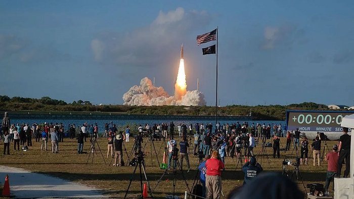 Spectators are kept at a safe distance, but the deep rumbling of the rocket launch can still be physically felt