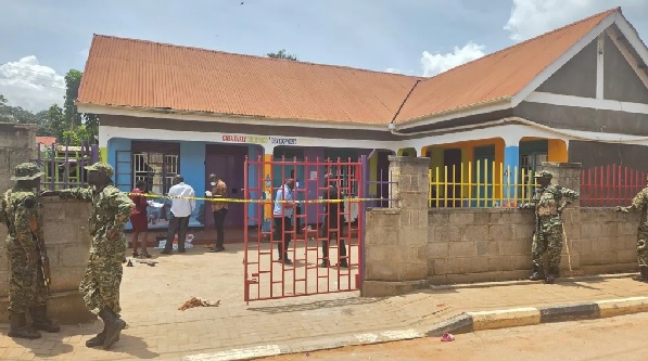 Worried parents gathered outside the school in Kampala after news of the attack spread