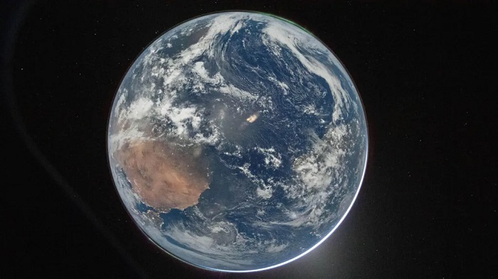 The image, titled Hello, World, shows the Earth as seen from the Orion capsule